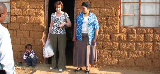 Cheryl outside Musa rural house