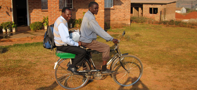 Two men on a bicycle in Malawi
