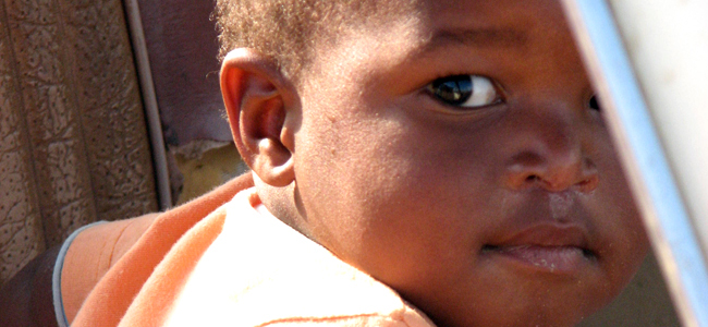 boy staring out from a car